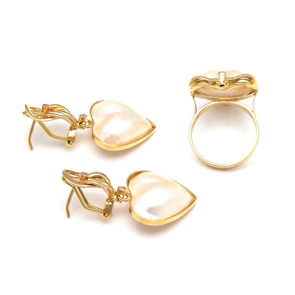 Juego de anillo y aretes diseño especial motivo corazón con medias perlas y circonias en oro amarillo 14 kilates.