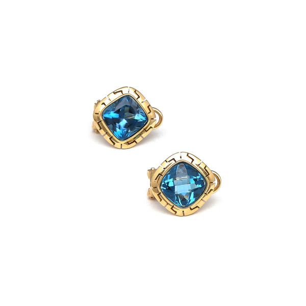 Aretes calados con topacios azules en oro amarillo 14 kilates.